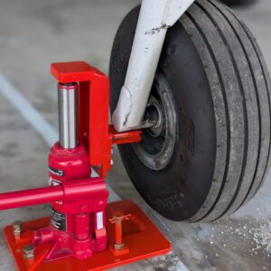 Jack lifting airplane off the ground